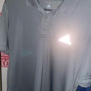 Men’s adidas polo charcoal with silver emblem